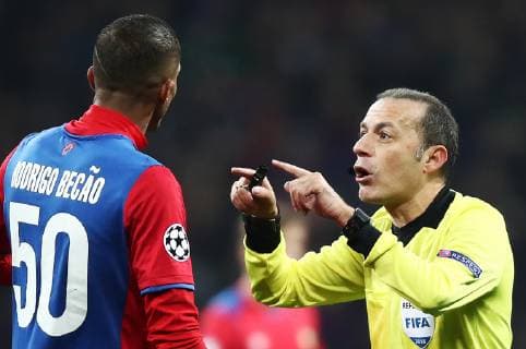 MOSCOW, RUSSIA â€“ NOVEMBER 7, 2018: CSKA Moscowâ€™s Rodrigo Becao (L) and referee Cuneyt Cakir in their 2018 19 UEFA Champions League Group G Round 4 football match against AS Roma at Luzhniki Stadium. Valery Sharifulin TASS  TS0969AE
