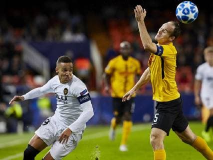 7th November 2018, Mestalla Stadium, Valencia, Spain; UEFA Champions League football, Valencia versus Young Boys; Forward Rodrigo Moreno of Valencia CF goes past Steve von Bergen of Young Boys to assist Santi Mina of Valencia CF with his goal  ActionPlus12077037 IvanxArlandis