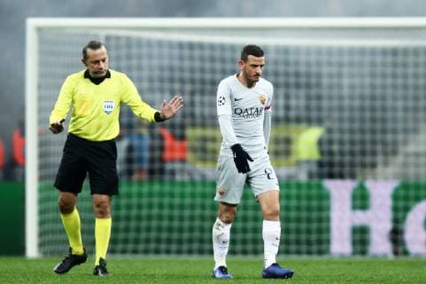 MOSCOW, RUSSIA â€“ NOVEMBER 7, 2018: Referee Cuneyt Cakir (L) and AS Romaâ€™s Alessandro Florenzi in their 2018 19 UEFA Champions League Group G Round 4 football match against CSKA Moscow at Luzhniki Stadium; AS Roma won 2-1. Valery Sharifulin TASS  TS096A00