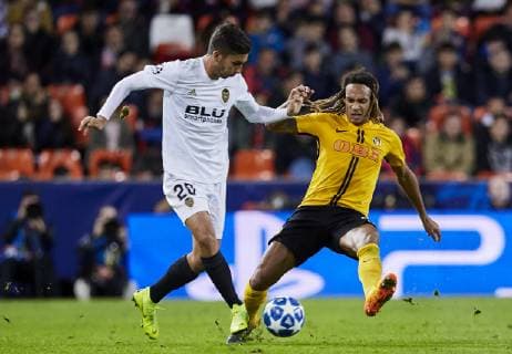 7th November 2018, Mestalla Stadium, Valencia, Spain; UEFA Champions League football, Valencia versus Young Boys; Ferran Torres of Valencia CF tackled by Kevin Mbabu of Young Boys  ActionPlus12077123 IvanxArlandis