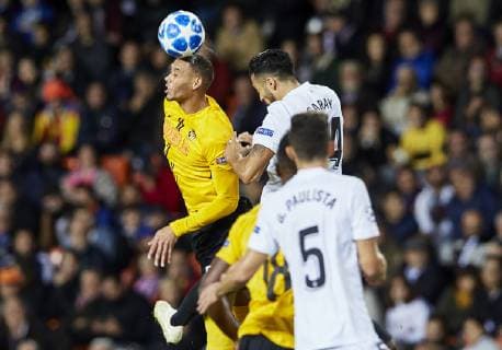 7th November 2018, Mestalla Stadium, Valencia, Spain; UEFA Champions League football, Valencia versus Young Boys; Midfielder Djibril Sow of Young Boys wins the header from Defender Ezequiel Garay of Valencia CF  ActionPlus12077116 IvanxArlandis
