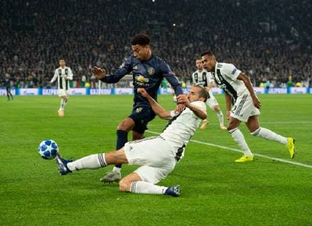 Juventus v Manchester United ManU UEFA Champions League Giorgio Chiellini of Juventus (nearest) tackles Jesse Lingard of Manchester United during the UEFA Champions League match at Juventus Stadium, Turin Content Not Available For UK Newspapers Copyright: xRussellxHartx FIL-12512-0094