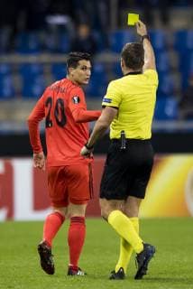 Besiktas Necip Uysal receives a yellow card from referee Tobias Stieler during a match between Belgian soccer team KRC Genk and Turkish club Besiktas, in Genk, Thursday 08 November 2018 on day four of the UEFA Europa League group stage, in group I. JASPERxJACOBS  x05464366x