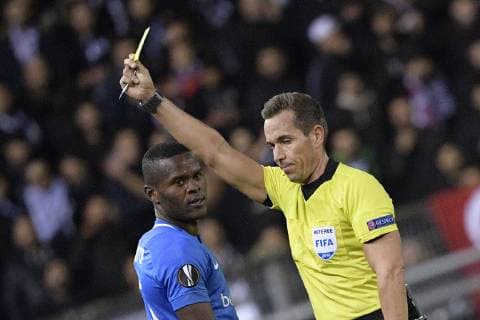 Genk s Aly Mbwana Samatta receives a yellow card from referee Tobias Stieler during a match between Belgian soccer team KRC Genk and Turkish club Besiktas, in Genk, Thursday 08 November 2018 on day four of the UEFA Europa League group stage, in group I. YORICKxJANSENS  x05464389x