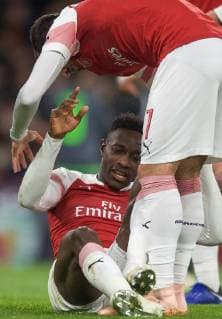 Danny Welbeck of Arsenal sits injured as Henrikh Mkhitaryan of Arsenal tries to help during the UEFA Europa League group match between Arsenal and Sporting Clube de Portugal at the Emirates Stadium, London, England on 8 November 2018. Copyright: xPRiMExMediaxImagesx PMI-2394-0013