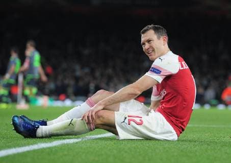 Football - 2018 2019 UEFA Europa League - Group E: Arsenal vs. Sporting Lisbon Stephan Lichtsteiner of Arsenal goes down with a hamstring injury, at The Emirates. COLORSPORT ANDREW COWIE 