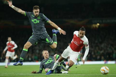 (181109) -- LONDON, Nov. 9, 2018 (Xinhua) -- Sporting Lisbon s Jeremy Mathieu (Bottom) fouls Arsenal s Pierre-Emerick Aubameyang (R) as Sporting Lisbon s Sebastian Coates (L) looks on during the UEFA Europa League group E match between Arsenal and Sporting Lisbon at the Emirates Stadium in London, Britain on Nov. 8, 2018. The final score was 0-0. (Xinhua Tim Ireland) FOR EDITORIAL USE ONLY. NOT FOR SALE FOR MARKETING OR ADVERTISING CAMPAIGNS. NO USE WITH UNAUTHORIZED AUDIO, VIDEO, DATA, FIXTURE LISTS, CLUB LEAGUE LOGOS OR LIVE SERVICES. ONLINE IN-MATCH USE LIMITED TO 45 IMAGES, NO VIDEO EMULATION. NO USE IN BETTING, GAMES OR SINGLE CLUB LEAGUE PLAYER PUBLICATIONS. (SP) BRITAIN-LONDON-FOOTBALL-EUROPA LEAGUE-ARSENAL VS SPORTING LISBON