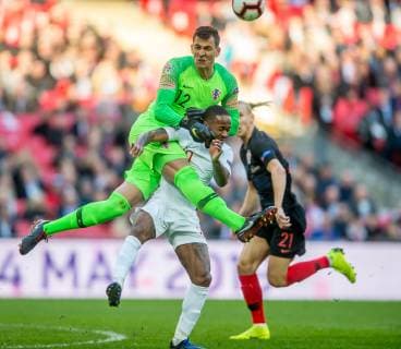 Lovre Kalinic of Croatia clashes with Raheem Sterling of England during the UEFA Nation League Group Stage match between England and Croatia at Wembley Stadium, London, England on 18 November 2018. Copyright: xSalvioxCalabresex 21990003