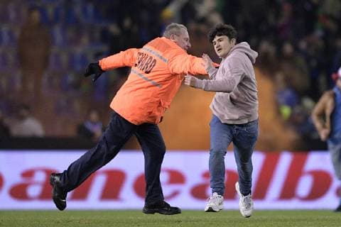 Illustration picture shows a steward chasing an Italian supporter on the pitch after a friendly soccer game between Italy and USA in Genk, Tuesday 20 November 2018. YORICKxJANSENS  x05473731x