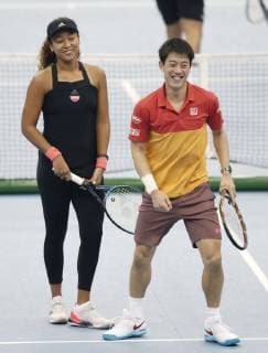 Tennis: Osaka, Nishikori play in charity match Japan s Naomi Osaka (L) and Kei Nishikori play a charity mixed doubles tennis match in Nagoya, central Japan, on Nov. 25, 2018. 