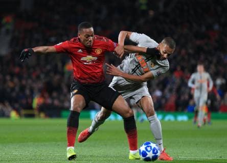 Anthony Martial of Manchester United ManU tussles with Djibril Sow of Young Boys during the UEFA Champions League match at Old Trafford, Manchester. Picture date 27th November 2018. Picture credit should read: Matt McNulty Sportimage EDITORIAL USE ONLY. No use with unauthorised audio, video, data, fixture lists, club league logos or live services. Online in-match use limited to 120 images, no video emulation. No use in betting, games or single club league player publications.