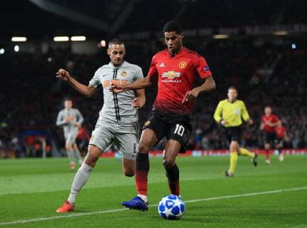 Marcus Rashford of Manchester United ManU tackled by Djibril Sow of Young Boys during the UEFA Champions League match at Old Trafford, Manchester. Picture date 27th November 2018. Picture credit should read: Matt McNulty Sportimage EDITORIAL USE ONLY. No use with unauthorised audio, video, data, fixture lists, club league logos or live services. Online in-match use limited to 120 images, no video emulation. No use in betting, games or single club league player publications.