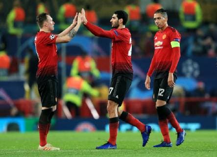 Manchester United ManU s Marouane Fellaini celebrates with Phil Jones at full time during the UEFA Champions League match at Old Trafford, Manchester. Picture date 27th November 2018. Picture credit should read: Matt McNulty Sportimage EDITORIAL USE ONLY. No use with unauthorised audio, video, data, fixture lists, club league logos or live services. Online in-match use limited to 120 images, no video emulation. No use in betting, games or single club league player publications.