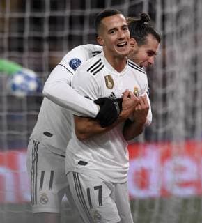 (181128) -- ROME, Nov. 28, 2018 -- Real Madrid s Lucas Vazquez (front) celebrates by his teammate Gareth Bale during a group G match of UEFA Champions League between Roma and Real Madrid, in Rome, Italy, Nov. 27, 2018. Real Madrid won 2-0. ) (SP)ITALY-ROME-SOCCER-UEFA CHAMPIONS LEAGUE-ROMA VS REAL MADRID AlbertoxLingria 