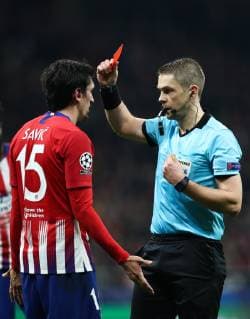 MADRID, SPAIN â€“ NOVEMBER 28, 2018: Referee Mattias Gestranius (R) shows the red card to Atletico Madridâ€™s Stefan Savic in their 2018 19 UEFA Champions League Group A Round 5 football match against AS Monaco at Madridâ€™s Wanda Metropolitano; Atletico Madrid won 2-0. Stanislav Krasilnikov TASS  TS09928D