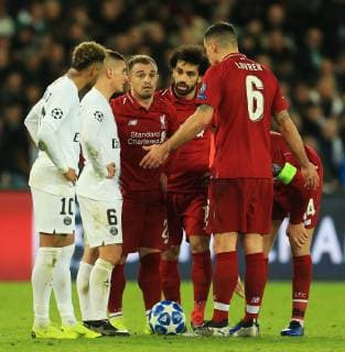 Liverpool s Dejan Lovren reacts as Xherdan Shaqiri and Mo Salah argue over a free kick during the UEFA Champions League Group C match at the Parc des Princes Stadium, Paris. Picture date: 28th November 2018. Picture credit should read: Matt McNulty Sportimage EDITORIAL USE ONLY. No use with unauthorised audio, video, data, fixture lists, club league logos or live services. Online in-match use limited to 120 images, no video emulation. No use in betting, games or single club league player publications. SPI_MM_PSG_Liverpool_125.JPG