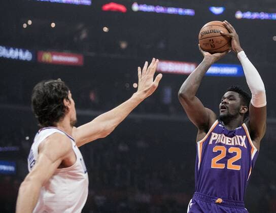 November 28, 2018 - Los Angeles, California, U.S - Deandre Ayton 22 of the Phoenix Suns takes a shot over Boban Marjanovic 51 of the Los Angeles Clippers during their NBA Basketball Herren USA game on Wednesday November 28, 2018 at the Staples Center in Los Angeles, California. Clippers vs Suns. Clippers vs Suns - ZUMAp124 20181128_zaa_p124_021 Copyright: xJavierxRojasx