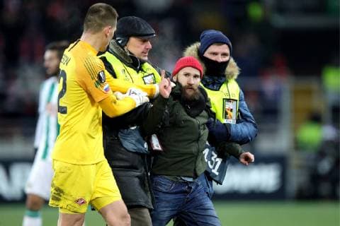 MOSCOW, RUSSIA - NOVEMBER 29, 2018: Security guards detain a pitch invader during the 2018 19 UEFA Europa League Group G Round 5 football match between Spartak Moscow and Rapid Vienna at Otkrytie Arena. Sergei Bobylev TASS  TS099478
