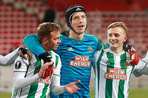 MOSCOW, RUSSIA - NOVEMBER 29, 2018: Rapid Vienna s Philipp Schobesberger, goalkeeper Richard Strebinger, Manuel Thurnwald (L-R) celebrate their victory in the 2018 19 UEFA Europa League Group G Round 5 football match against Spartak Moscow at Otkrytie Arena. Sergei Fadeichev TASS  TS099490