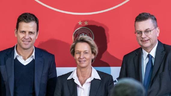 v li Oliver Bierhoff DFB Director National Teams and Academy Martina Voss Tecklenburg national coach of women national team Reinhard Grindel DFB president football women national team presentation national coach DFB REGULATIONS PROHIBIT ANY USE OF PHOTOGRAPHS AS IMAGE SEQUENCES AND OR QUASI VIDEO xprx