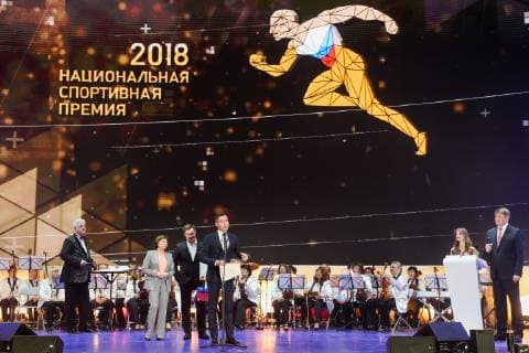 MOSCOW, RUSSIA â€“ DECEMBER 4, 2018: State Duma member and Olympic champion in Figure skating Eiskunstlauf Irina Rodnina, Russia s four-time Olympic champion in artistic gymnastics Alexei Nemov, and Vladimir Leonov, youth affairs and sports minister of the Republic of Tatarstan, from left front, at a ceremony to present the 2018 Russian national prize at the office of the Ministry of Sport of Russia. Vladimir Gerdo TASS  TS099C86
