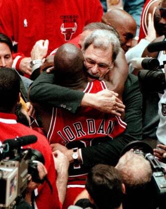 June 14, 1998 - Salt Lake City, UT, USA - Chicago Bull s coach Phil Jackson hugs Michael Jordan after the Bulls won their 6th championship at the Delta Center in Salt Lake City, Utah in 1998. A look back at some of the memorable exits from Bulls head choaches - ZUMAm67_ 19980614_zaf_m67_001 Copyright: xCharlesxCherneyx