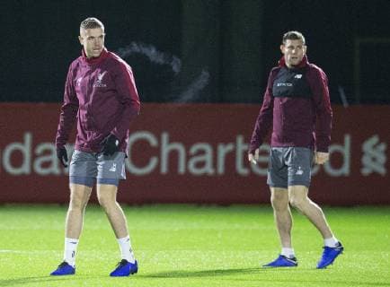 10th December 2018, Melwood, Liverpool, England, UEFA Champions League football, Liverpool versus Napoli,Liverpool training at Melwood ; Jordan Henderson and Daniel Sturridge of Liverpool warm up at the start of the training session  ActionPlus12086622 DavidxBlunsden