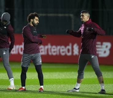 10th December 2018, Melwood, Liverpool, England, UEFA Champions League football, Liverpool versus Napoli,Liverpool training at Melwood ; Mohamed Salah and Dejan Lovren of Liverpool warm up at the start of the session  ActionPlus12086623 DavidxBlunsden