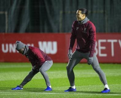 10th December 2018, Melwood, Liverpool, England, UEFA Champions League football, Liverpool versus Napoli,Liverpool training at Melwood ; Naby Keita and Virgil van Dijk of Liverpool warm up before the session  ActionPlus12086624 DavidxBlunsden