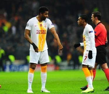 Ryan Donk (L) and Garry Rodrigues (R) of Galatasaray during the Champions League group D match between Galatasaray and Porto at Turk Telkom Stadium n Istanbul , Turkey on December 11 , 2018. 