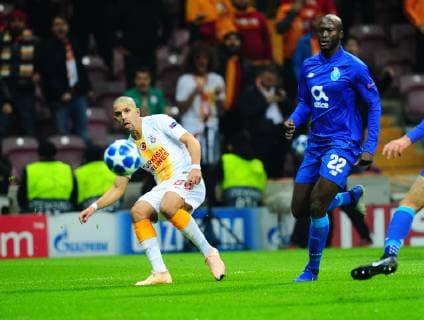 Sofiane Feghouli (L) of Galatasaray and Danilo Pereira 22 of Porto during the Champions League group D match between Galatasaray and Porto at Turk Telkom Stadium n Istanbul , Turkey on December 11 , 2018. 