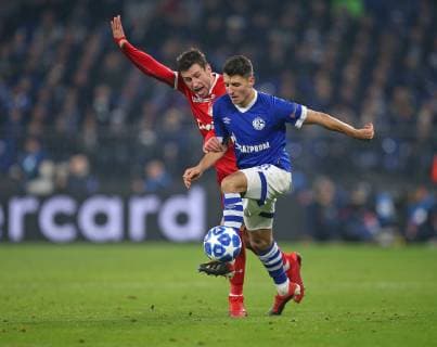 11 12 2018 Football UEFA Champions League 2018 2019 Group stage 6 Matchday FC Schalke 04 Locomotive Moscow in the VELTINS Arena Gelsenkirchen L R Grzegorz Krychowiak Lok Moskau vs. Alessandro Schöpf Schalke DFL and DFB regulations prohibit any use of photographs as image sequences and or quasi video