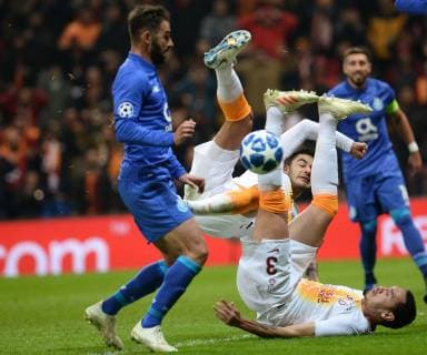 Maicon of Galatasaray and Adrian (L) of Porto during the Champions League group D match between Galatasaray and Porto at Turk Telkom Stadium n Istanbul , Turkey on December 11 , 2018. 