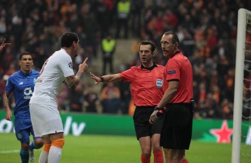 Referee Aleksei Kulbakov and Maicon of Galatasaray during the Champions League group D match between Galatasaray and Porto at Turk Telkom Stadium n Istanbul , Turkey on December 11 , 2018. 