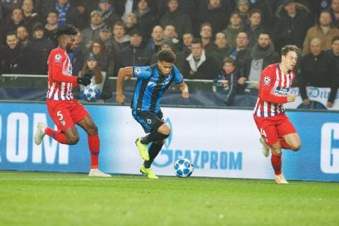Atletico s Thomas Teye Partey, Club s Cyril Ngonge and Atletico s Santiago Arias fight for the ball during a game between Belgian soccer team Club Brugge KV and Spanish club Athletico Madrid, in Brugge, Tuesday 11 December 2018, on the sixth and last day of the UEFA Champions League, in the group A. KURTxDESPLENTER  x05488092x