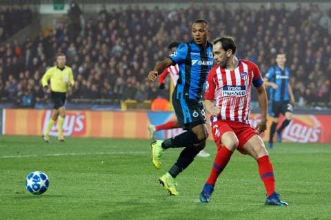 Club s Lois Openda and Atletico s captain Diego Roberto Godin fight for the ball during a game between Belgian soccer team Club Brugge KV and Spanish club Athletico Madrid, in Brugge, Tuesday 11 December 2018, on the sixth and last day of the UEFA Champions League, in the group A. KURTxDESPLENTER  x05488084x