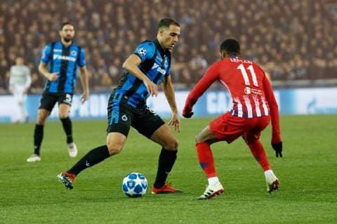 Club s Lois Openda and Atletico s Thomas Lemar fight for the ball during a game between Belgian soccer team Club Brugge KV and Spanish club Athletico Madrid, in Brugge, Tuesday 11 December 2018, on the sixth and last day of the UEFA Champions League, in the group A. KURTxDESPLENTER  x05488087x