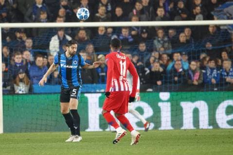 Club s Benoit Poulain and Atletico s Thomas Lemar fight for the ball during a game between Belgian soccer team Club Brugge KV and Spanish club Athletico Madrid, in Brugge, Tuesday 11 December 2018, on the sixth and last day of the UEFA Champions League, in the group A. KURTxDESPLENTER  x05488088x