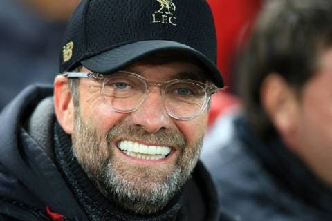 Sport Themen der Woche KW50 11th December 2018, Anfield, Liverpool, England; UEFA Champions League football, Liverpool versus Napoli; Liverpool manager Jurgen Klopp smiles as he takes his seat in the dugout  ActionPlus12086803 DavidxBlunsden