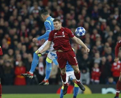 Jose Callejon of Napoli challenges with James Milner of Liverpool during the UEFA Champions League Group C match at Anfield Stadium, Liverpool. Picture date 11th December 2018. Picture credit should read: Andrew Yates Sportimage EDITORIAL USE ONLY. No use with unauthorised audio, video, data, fixture lists, club league logos or live services. Online in-match use limited to 120 images, no video emulation. No use in betting, games or single club league player publications. _AY20147.JPG