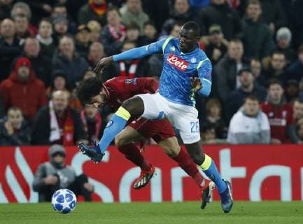 Kalidou Koulibaly of Napoli tackles Mohamed Salah of Liverpool during the UEFA Champions League Group C match at Anfield Stadium, Liverpool. Picture date 11th December 2018. Picture credit should read: Andrew Yates Sportimage EDITORIAL USE ONLY. No use with unauthorised audio, video, data, fixture lists, club league logos or live services. Online in-match use limited to 120 images, no video emulation. No use in betting, games or single club league player publications. _AY20162.JPG