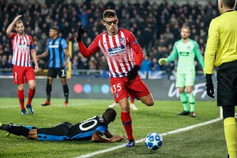 Athletico s Francisco Montero and Club s Lois Openda fight for the ball during a game between Belgian soccer team Club Brugge KV and Spanish club Athletico Madrid, in Brugge, Tuesday 11 December 2018, on the sixth and last day of the UEFA Champions League, in the group A. KURTxDESPLENTER  x05488104x