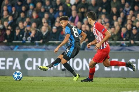 Club s Cyril Ngonge and Atletico s Santiago Arias fight for the ball during a game between Belgian soccer team Club Brugge KV and Spanish club Athletico Madrid, in Brugge, Tuesday 11 December 2018, on the sixth and last day of the UEFA Champions League, in the group A. KURTxDESPLENTER  x05488114x