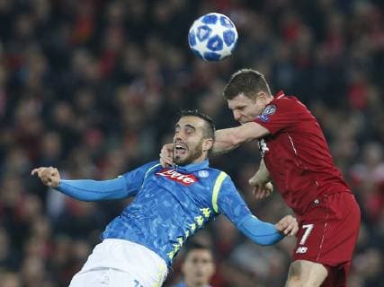 Nikola Maksimovic of Napoli challenged by James Milner of Liverpool during the UEFA Champions League Group C match at Anfield Stadium, Liverpool. Picture date 11th December 2018. Picture credit should read: Andrew Yates Sportimage EDITORIAL USE ONLY. No use with unauthorised audio, video, data, fixture lists, club league logos or live services. Online in-match use limited to 120 images, no video emulation. No use in betting, games or single club league player publications. _AY20417.JPG