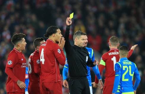 11th December 2018, Anfield, Liverpool, England; UEFA Champions League football, Liverpool versus Napoli; Virgil van Dijk of Liverpool is shown a yellow card  ActionPlus12086820 DavidxBlunsden