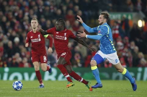 Sadio Mane of Liverpool runs clear of Fabian Ruiz of Napoli during the UEFA Champions League Group C match at Anfield Stadium, Liverpool. Picture date 11th December 2018. Picture credit should read: Andrew Yates Sportimage EDITORIAL USE ONLY. No use with unauthorised audio, video, data, fixture lists, club league logos or live services. Online in-match use limited to 120 images, no video emulation. No use in betting, games or single club league player publications. _AY20449.JPG