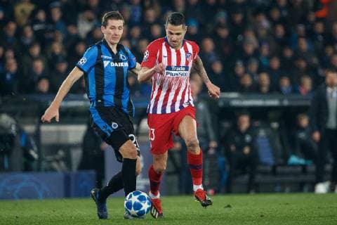 Club s Hans Vanaken and Atletico s Vitolo fight for the ball during a game between Belgian soccer team Club Brugge KV and Spanish club Athletico Madrid, in Brugge, Tuesday 11 December 2018, on the sixth and last day of the UEFA Champions League, in the group A. KURTxDESPLENTER  x05488237x