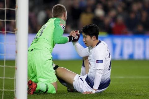 11th December 2018, Camp Nou, Barcelona, Spain; UEFA Champions League football, Barcelona versus Tottenham Hotspur; Son Heung-min of Tottenham helped up by Jasper Cillessen of FC Barcelona Barca  ActionPlus12086832 EricxAlonso