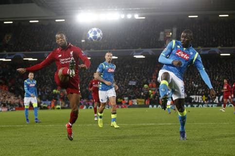 Georgina Wijnaldum of Liverpool lobs the ball over Kalidou Koulibaly of Napoli during the UEFA Champions League Group C match at Anfield Stadium, Liverpool. Picture date 11th December 2018. Picture credit should read: Andrew Yates Sportimage EDITORIAL USE ONLY. No use with unauthorised audio, video, data, fixture lists, club league logos or live services. Online in-match use limited to 120 images, no video emulation. No use in betting, games or single club league player publications. _AY19277.JPG