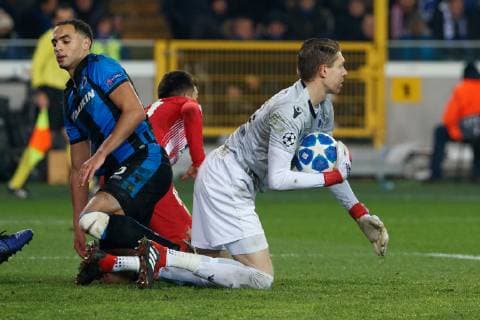 Club s Sofyan Amrabat and Club s goalkeeper Ethan Horvath fight for the ball during a game between Belgian soccer team Club Brugge KV and Spanish club Athletico Madrid, in Brugge, Tuesday 11 December 2018, on the sixth and last day of the UEFA Champions League, in the group A. KURTxDESPLENTER  x05488252x